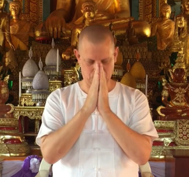 Teacher David Roylance with hands together in gratitude