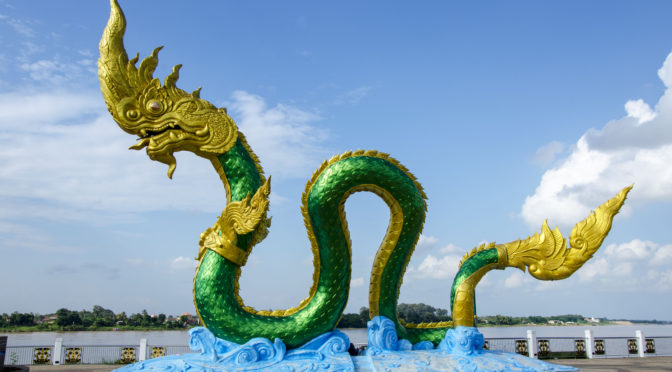 Naga serpent sculpture near water